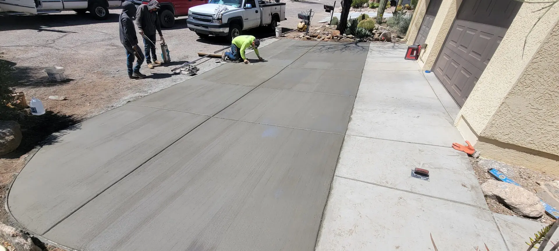 contractor working on a concrete driveway
